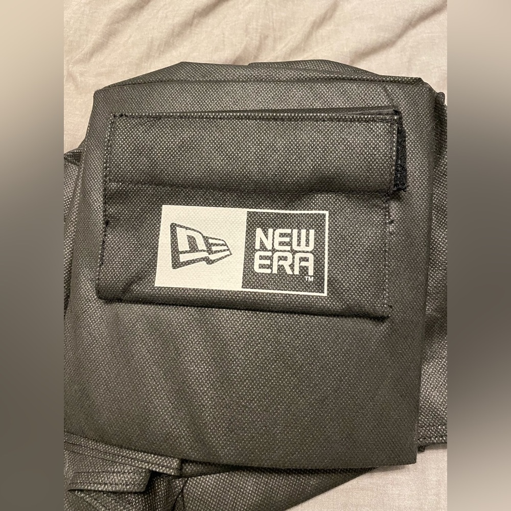 New Era Cap System